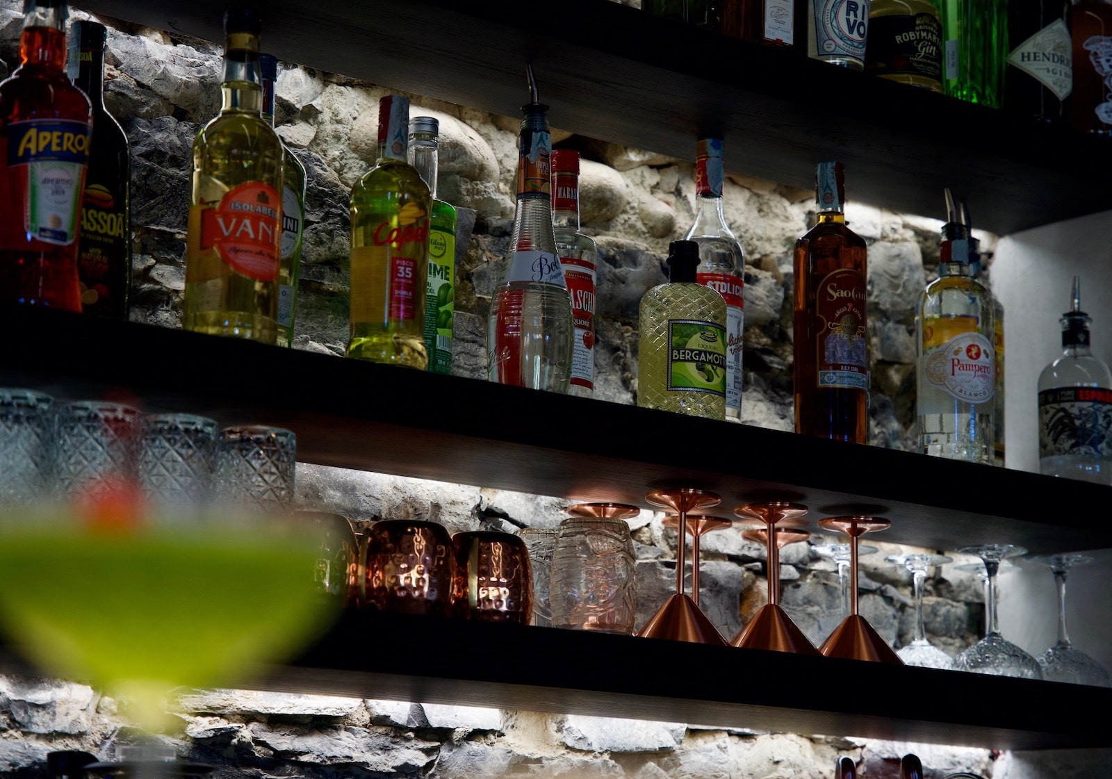 The wall of the cocktail bar Seta in Bellagio with the main spirits bottles
