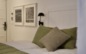 design hotel bedroom detail with frames and pillows